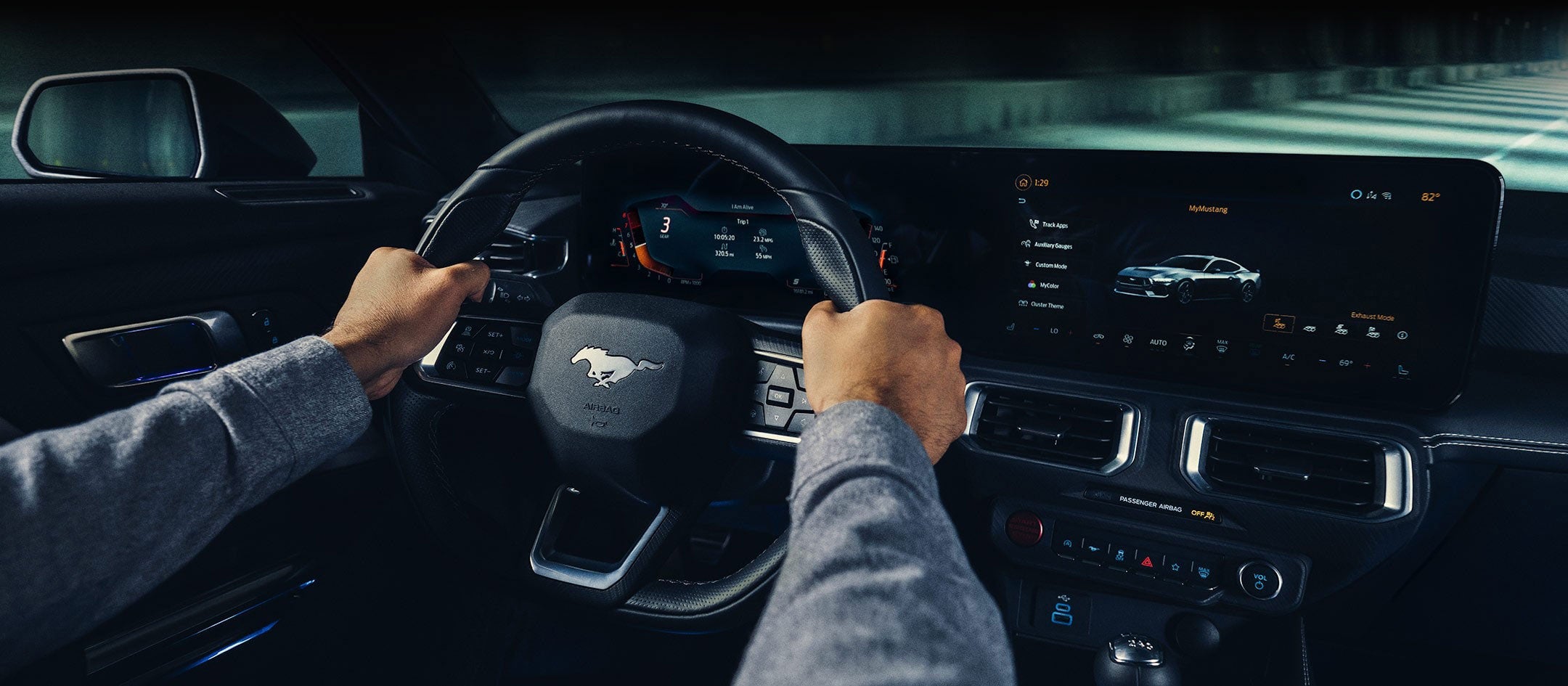A 2024 Ford Mustang® model interior with a person driving | Lombard Ford in Winsted CT